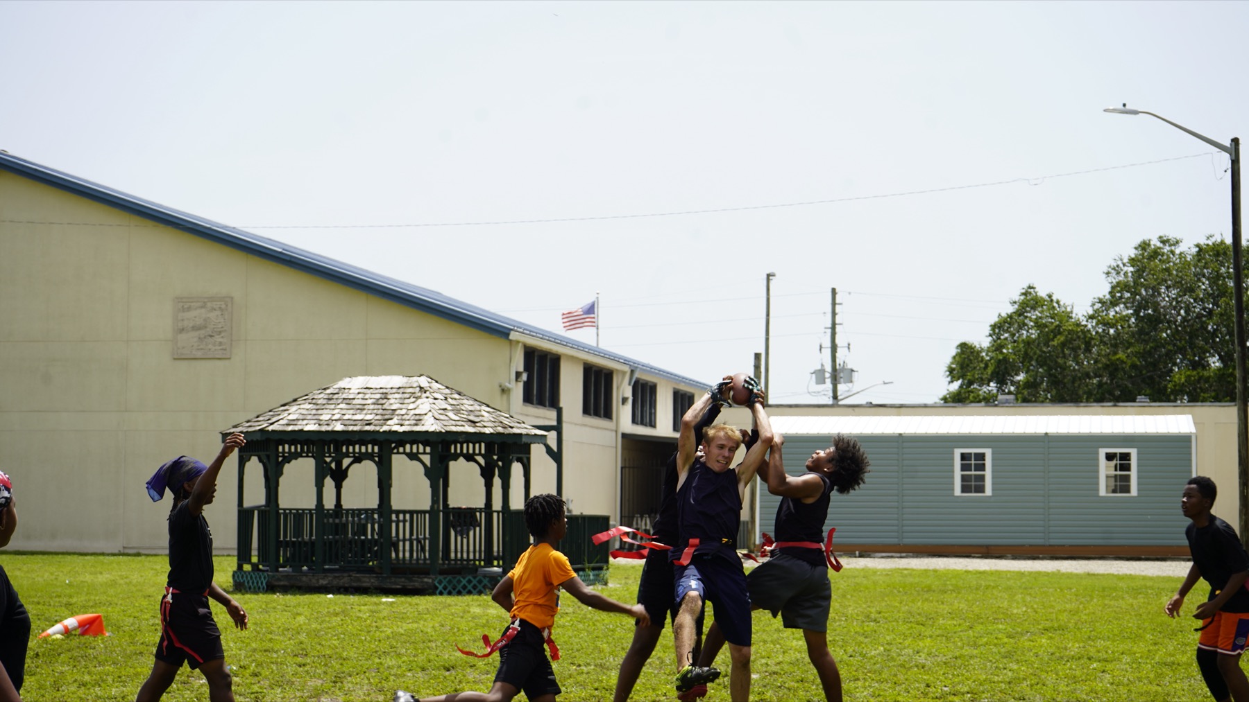 Athletes competing for a catch during a drill